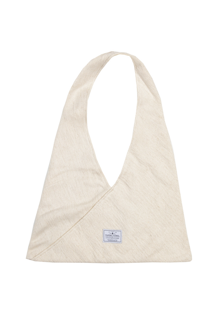 Slouchy white Turkish cotton hobo shoulder sling bag against a white background
