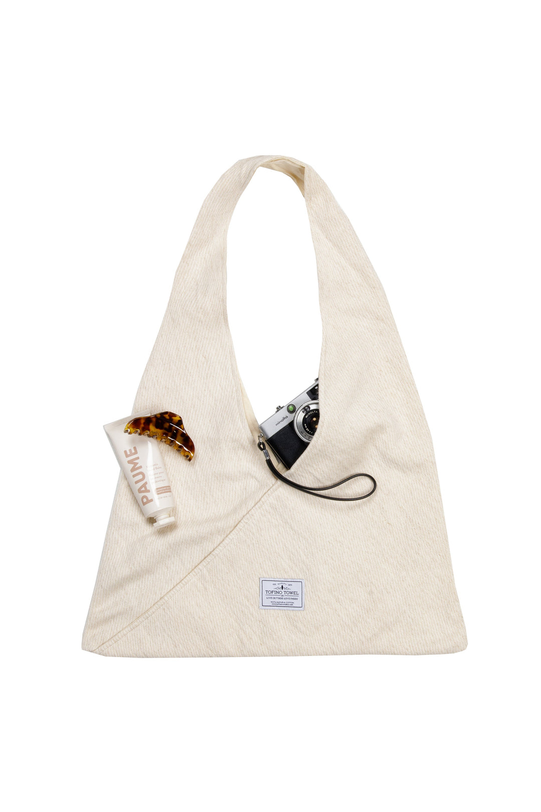 Slouchy white Turkish cotton hobo shoulder sling bag with accessories against a white background