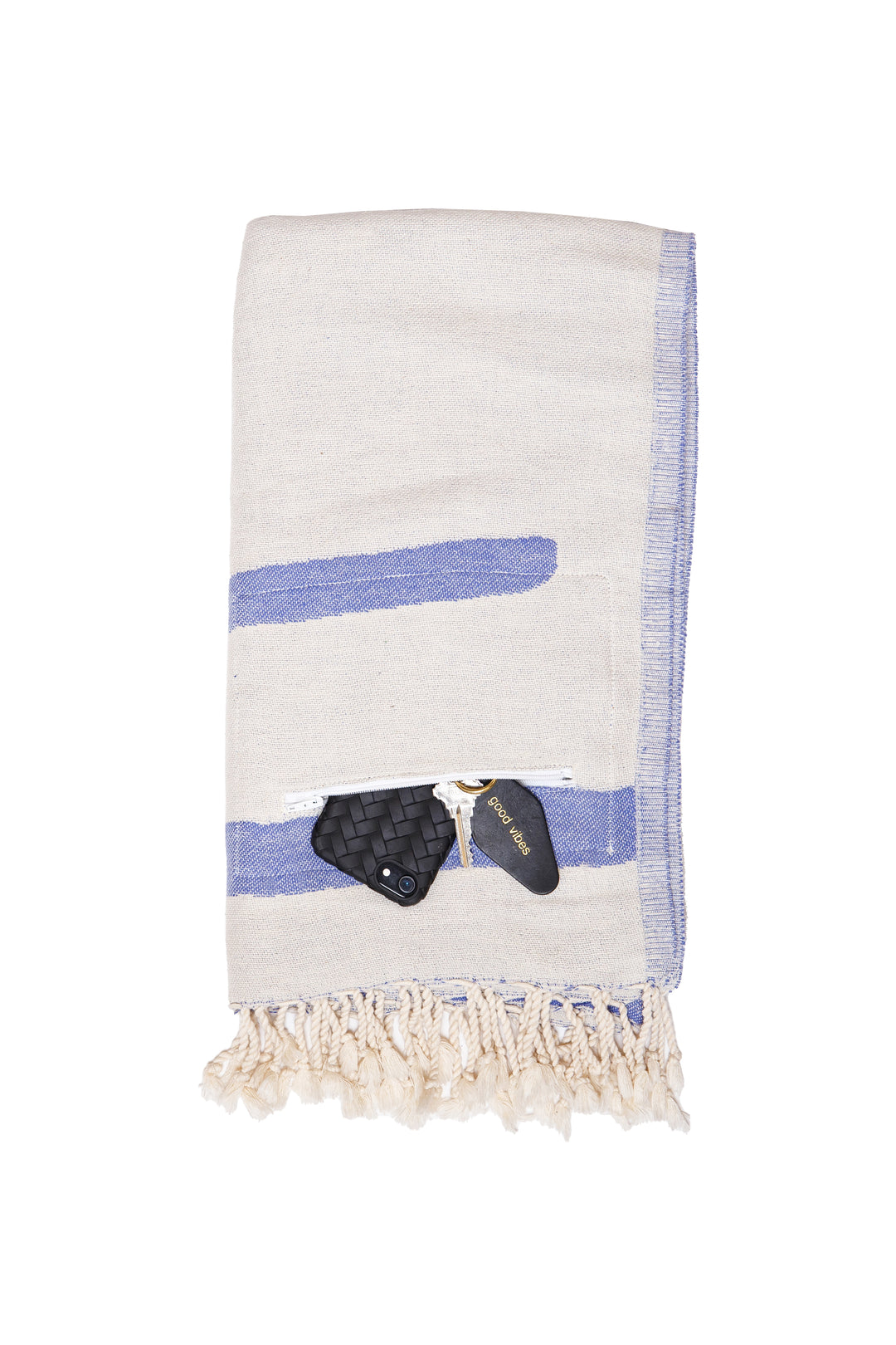 Turkish cotton towel with an abstract white and blue design. eyelash fringe and discreet zipper pocket folded on a white background #colour_blue