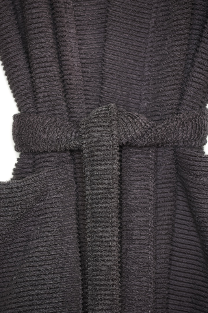 close up of dark grey cotton terry spa robe on a hanger against a white background #colour_charcoal