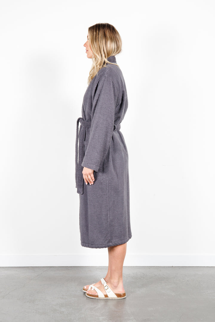 woman wearing mid length dark grey cotton terry relaxed fit spa robe #colour_charcoal