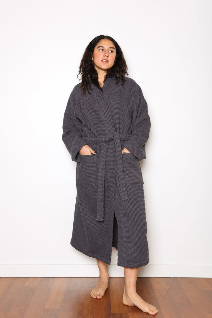 woman wearing mid length dark grey cotton terry relaxed fit spa robe #colour_charcoal