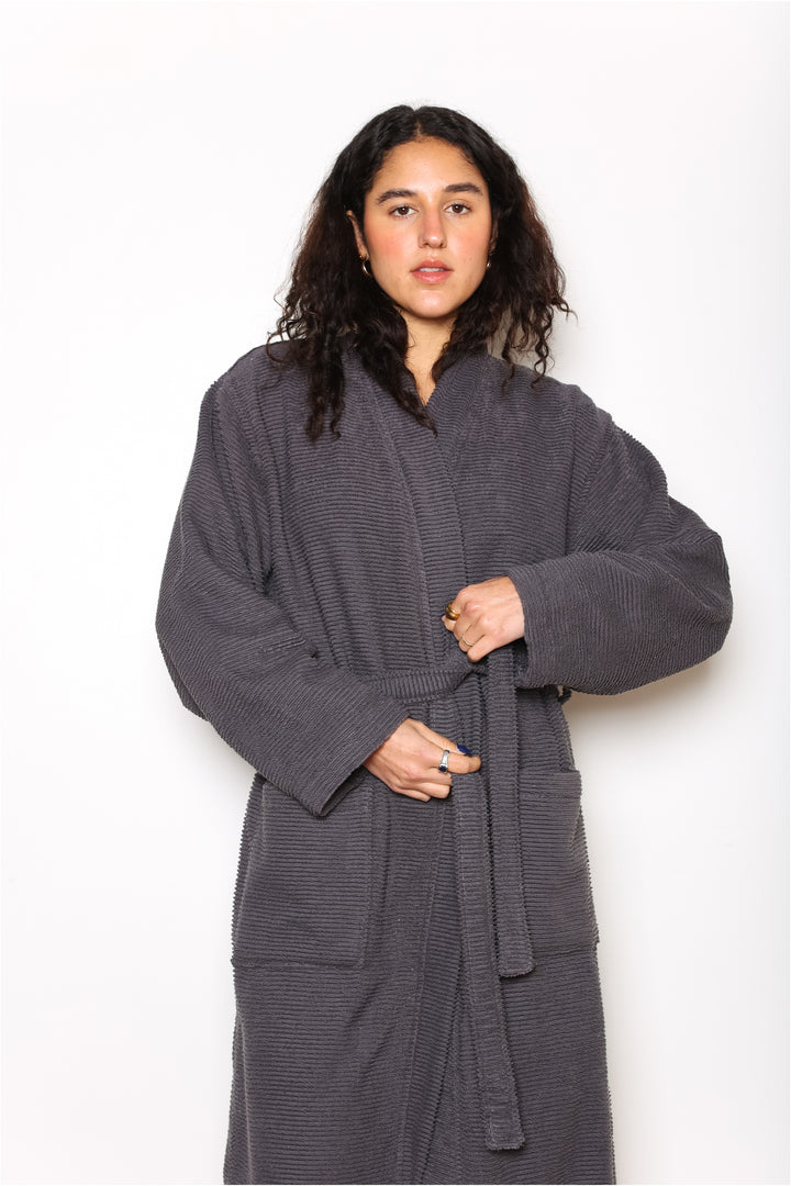woman wearing mid length dark grey cotton terry relaxed fit spa robe #colour_charcoal