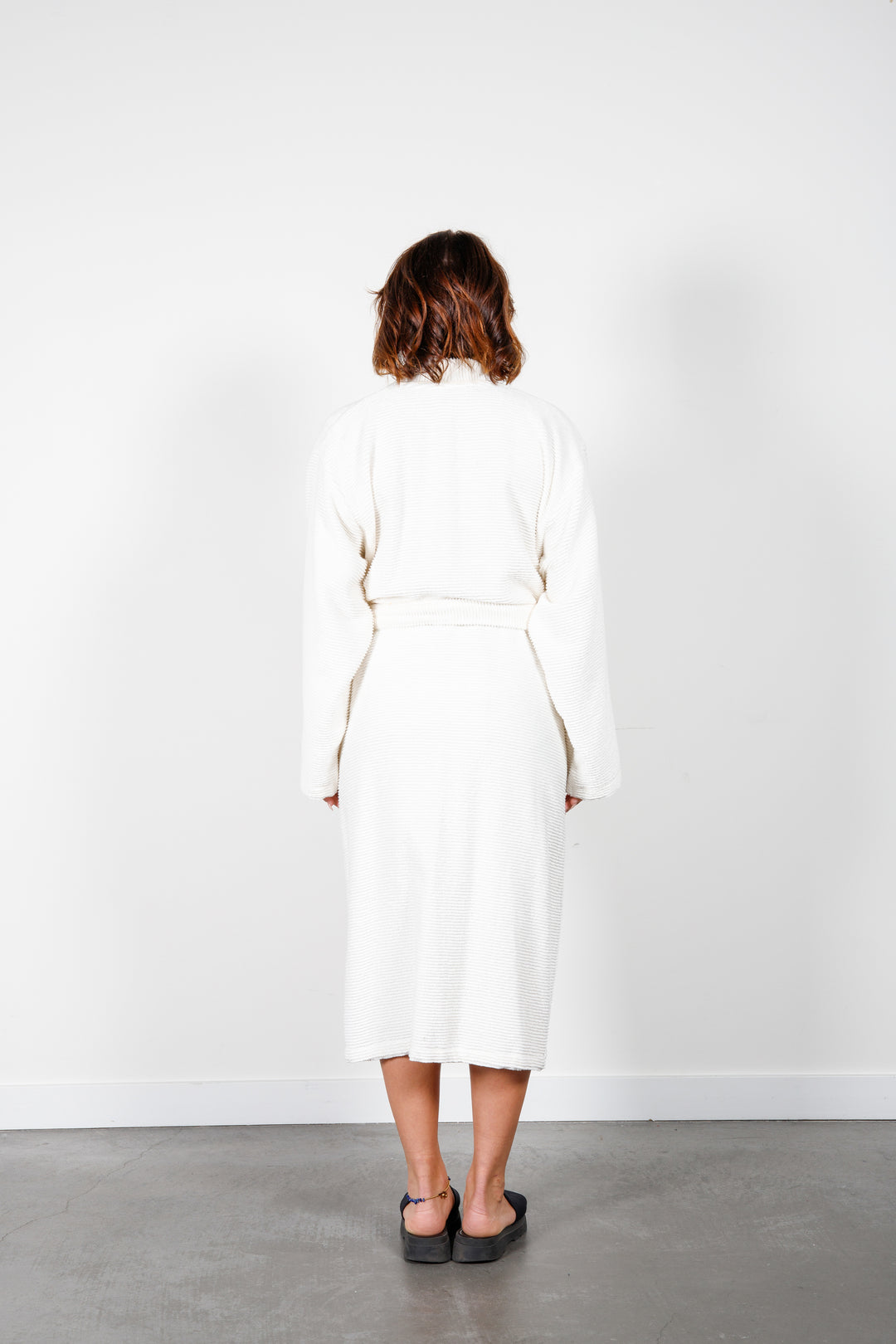 woman wearing mid length white cotton terry relaxed fit spa robe #colour_off-white