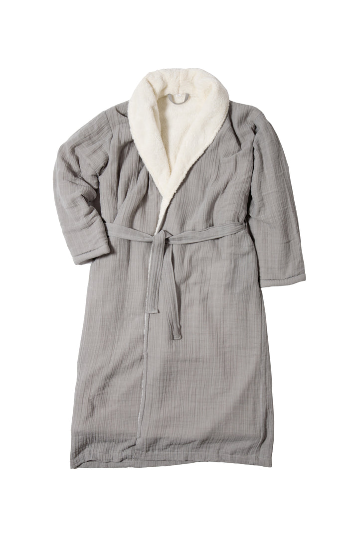 A long grey belted fleece lined muslin robe with pockets laid flat on a white background #colour_grey