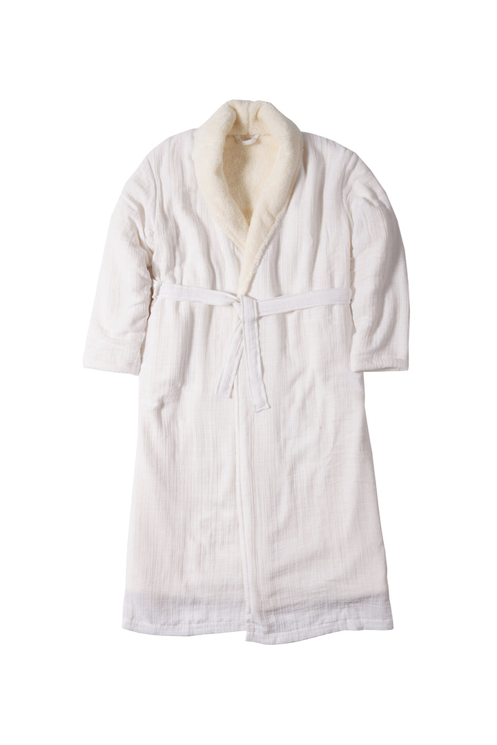 a long white belted fleece lined muslin robe with pockets laid flat on a white background. #colour_white