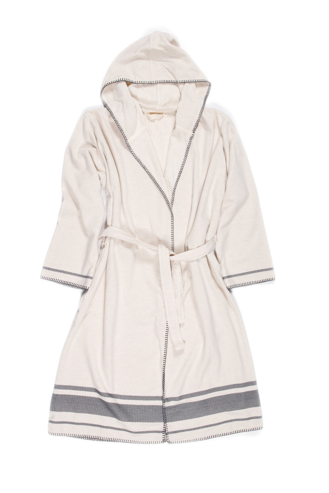A medium length beige hooded belted terry robe with gray stripes, and pockets. Laying flat on a white background