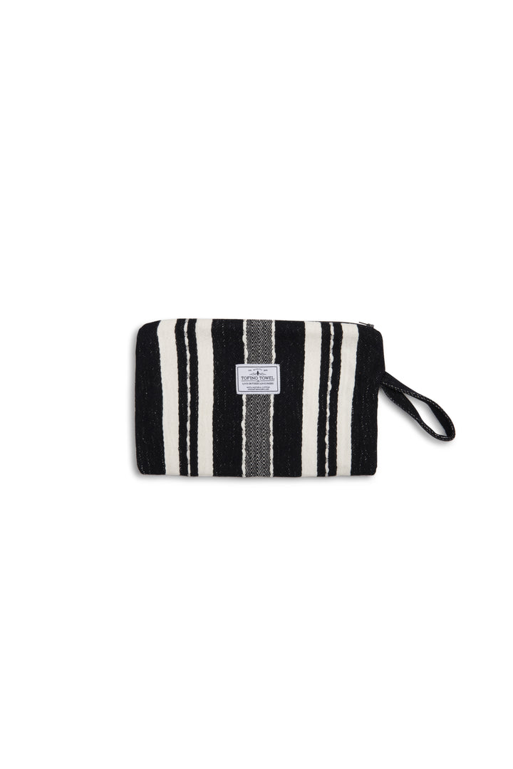 Black zip up pouch with white stripes and a wrist handle  on a white background