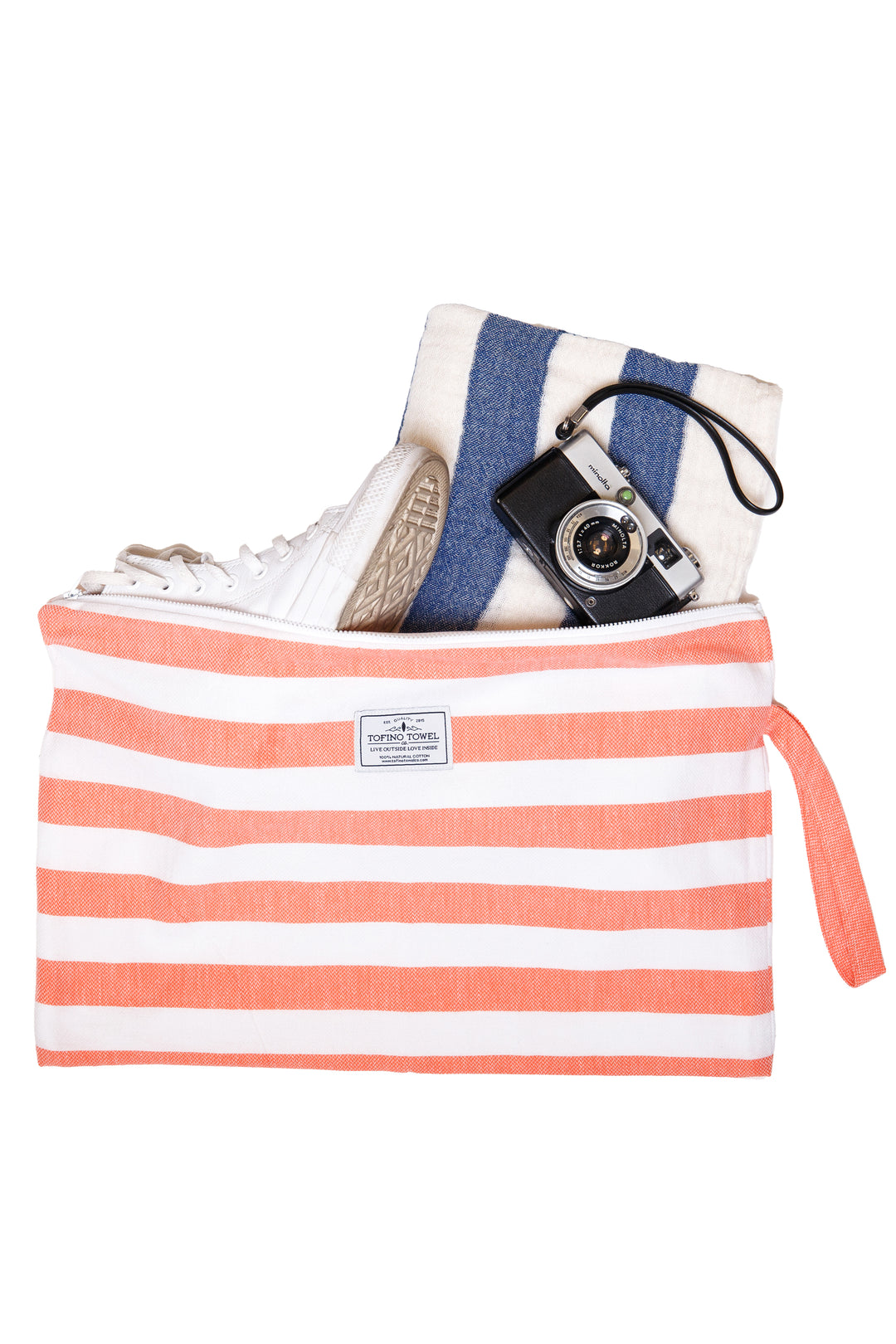 large white and coral striped zip up pouch with wrist handle containing accessories on a white background #colour_coral-stripes