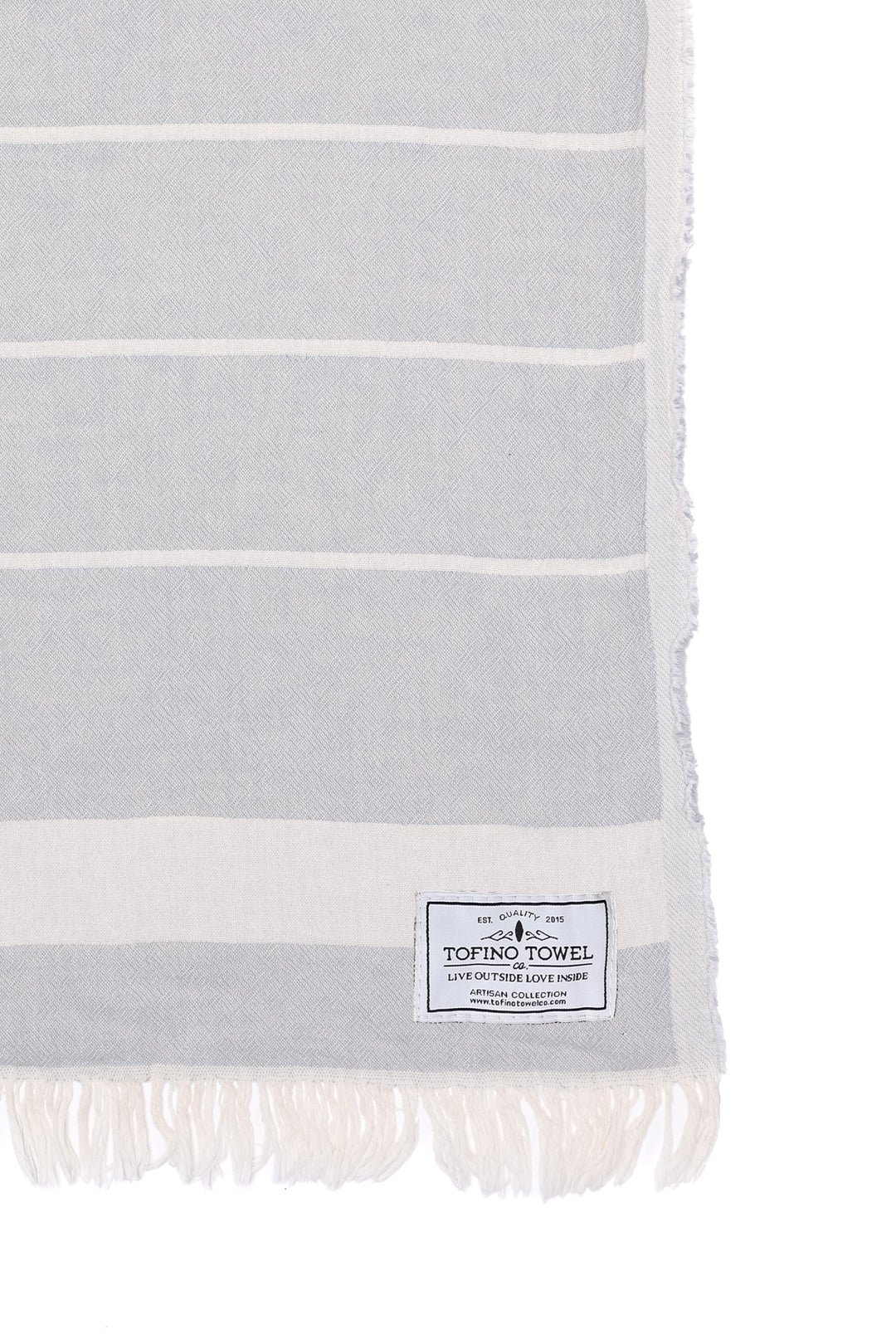 close up of light grey and off white fleece lined throw with eyelash fringe on a white background #colour_pewter