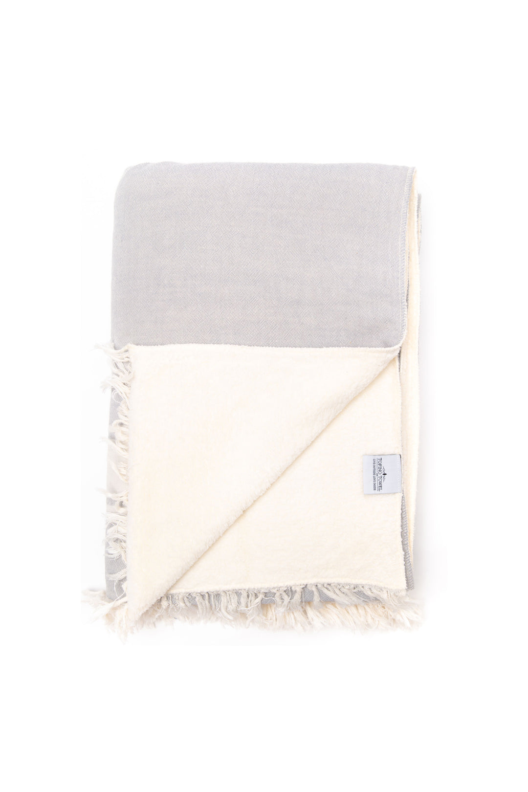 A light-grey fleece-lined Turkish throw with eyelash fringe, and simple stylized white stripes displayed on a white background #colour_pewter